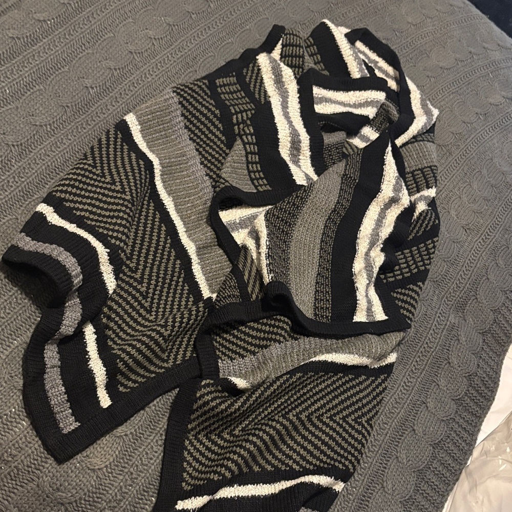 Asymmetrical knit sweater vest.